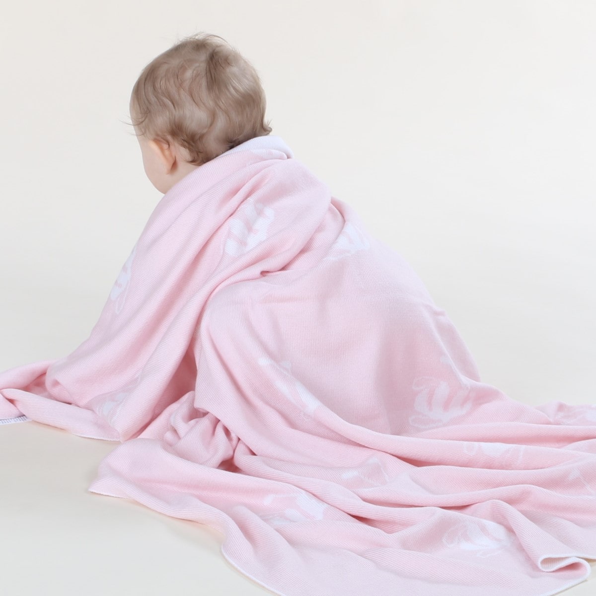 Dimples merino wool signature bee blanket in pink