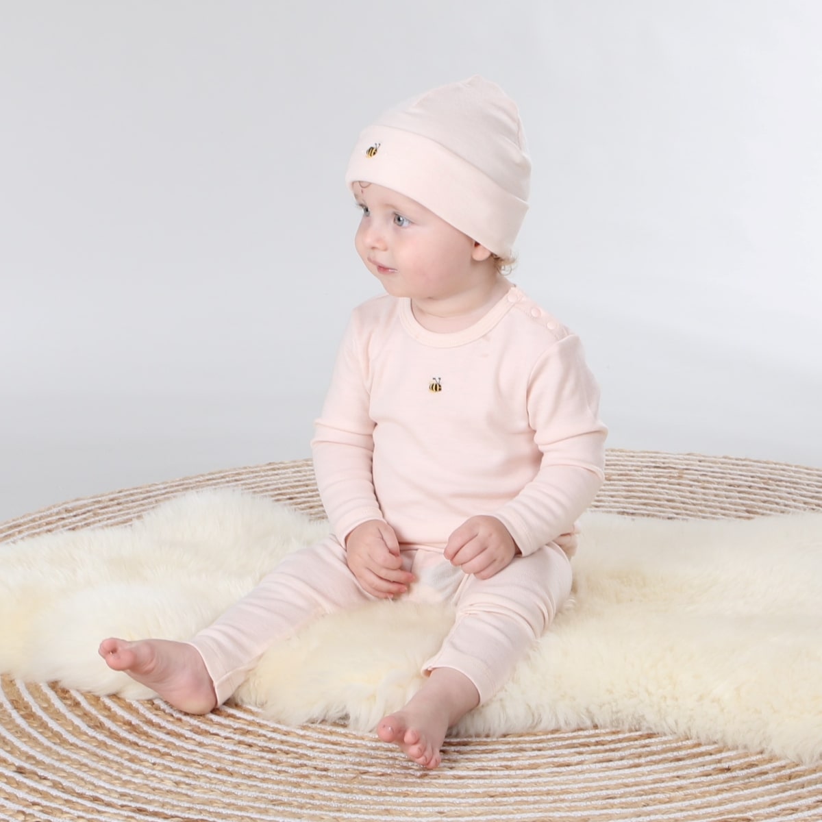 Dimples Snowglobe Merino Beanie Eggnog on baby