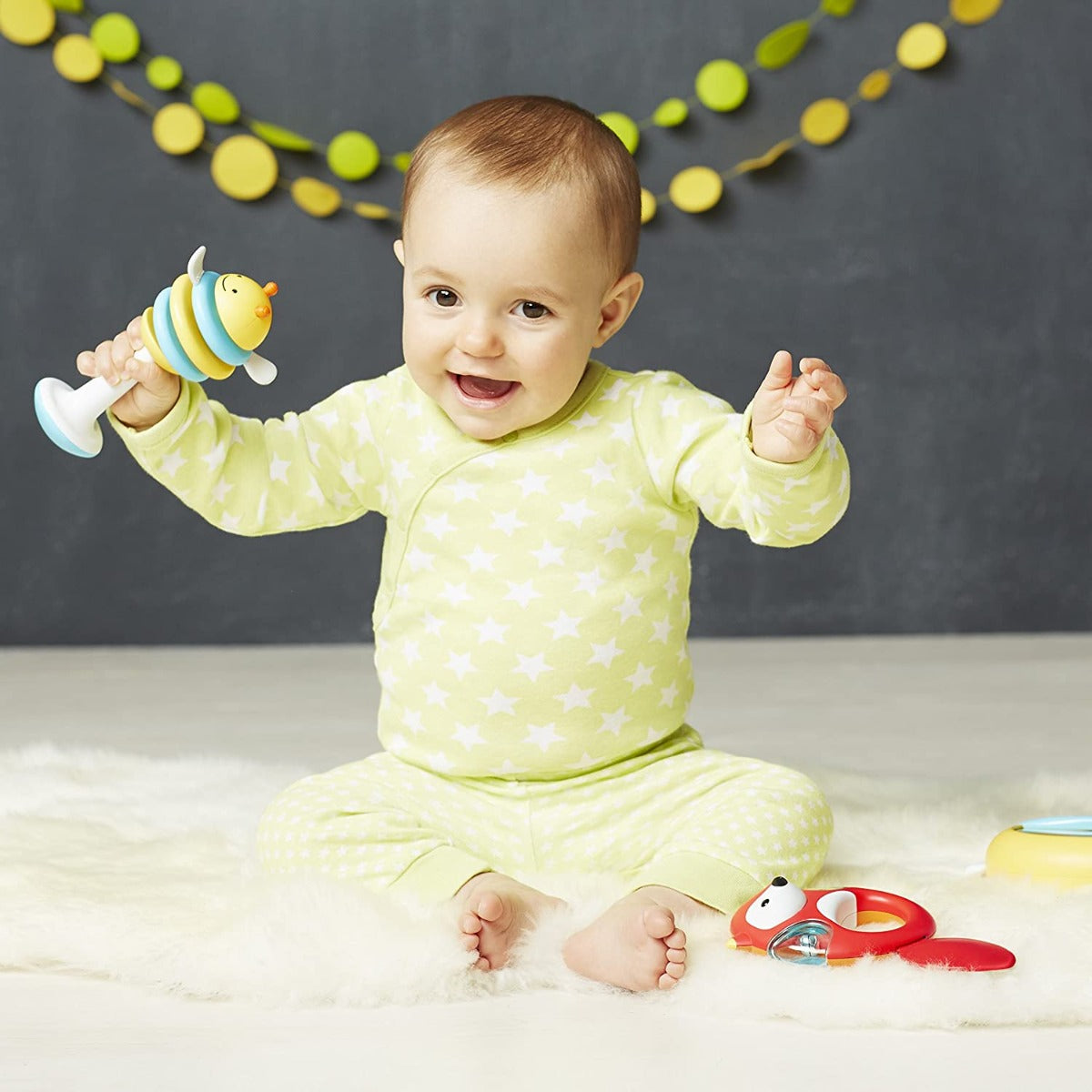 baby playing with Explore & More Musical Instrument Set 