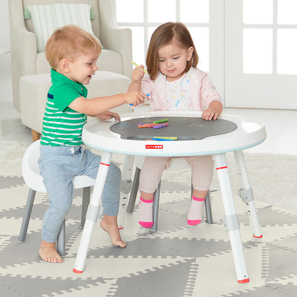 Two kids playing on Cloud 3 Stage Activity Centre with mat and colours