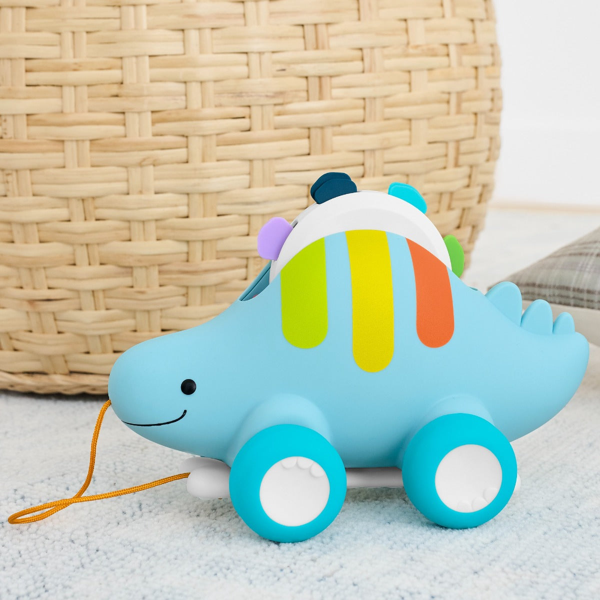 Skip Hop Explore & More Dinosaur 3-In-1 Baby Musical Pull Toy in the living room