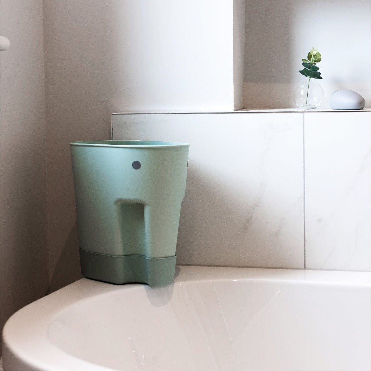 Ellie Toy Drying Caddy Eucalyptus by Shnuggle next to bath