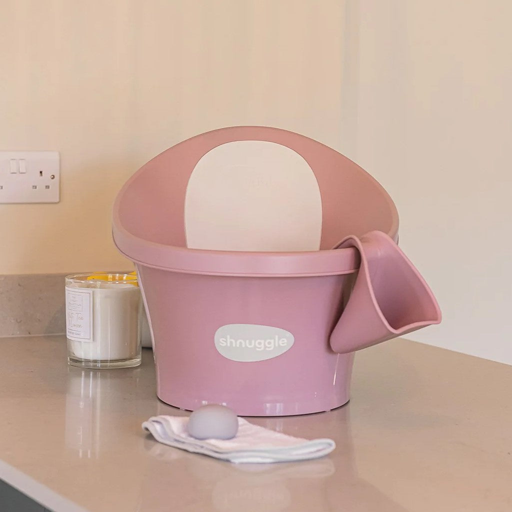 Shnuggle blossom washy bath jug with blossom shnuggle bath on a kitchen top