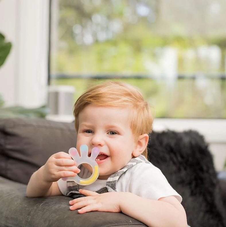 baby enjoying haakaa silicone palm teether