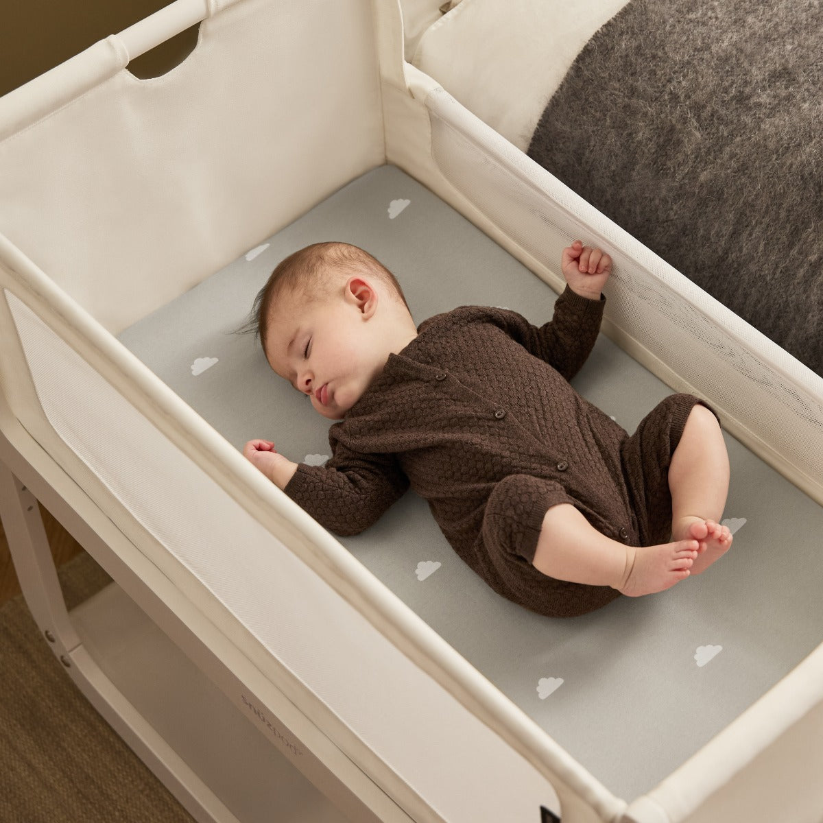 Baby Sleeping in Snuzpod 5 White Wood Frame Bedside Baby Crib