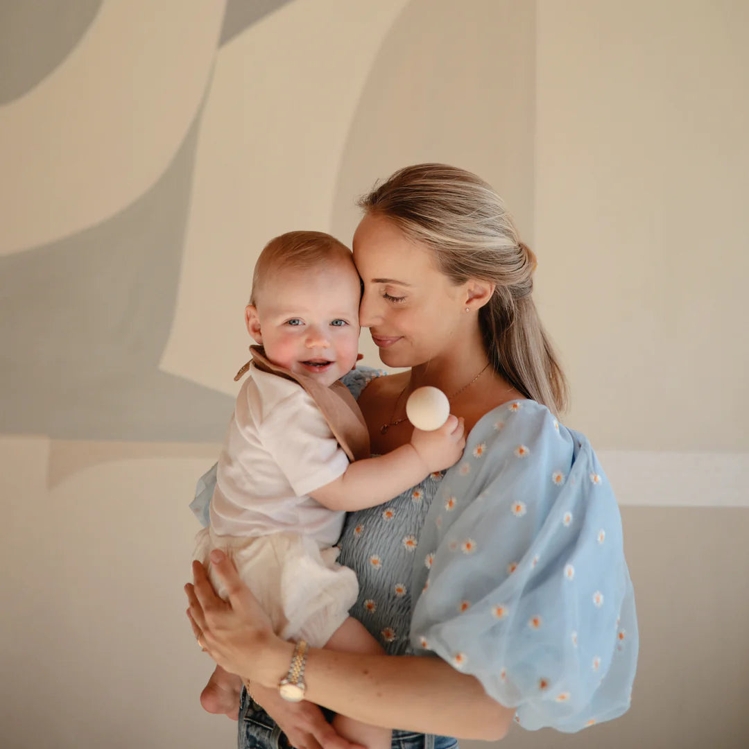 mushie silicone baby rattle in shifting sand