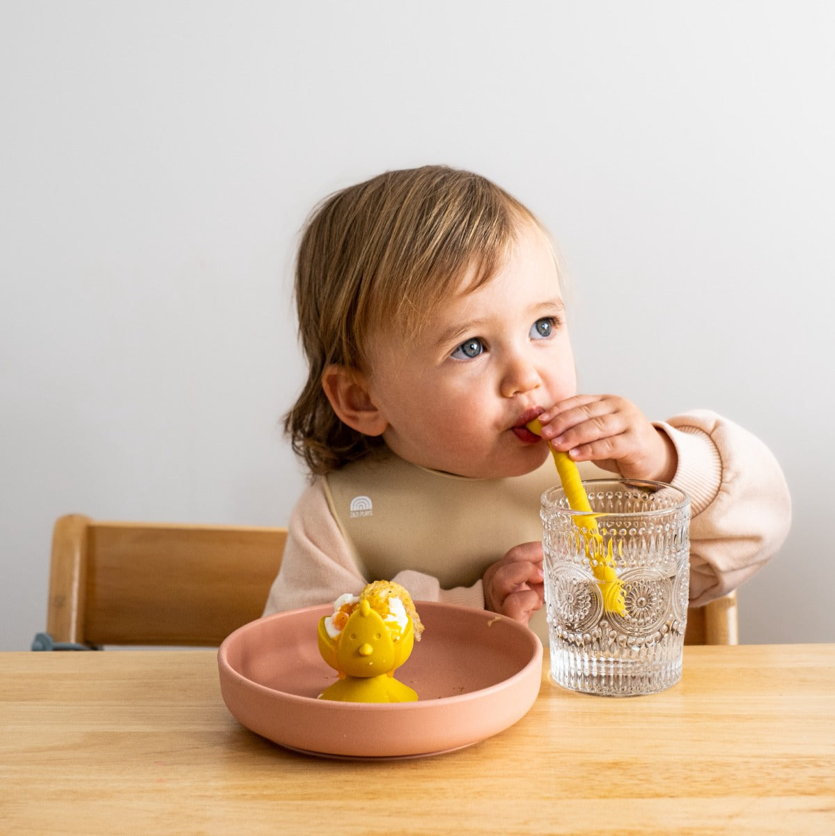 Baby drinking with Zazi silicone straw and dippy chick on side