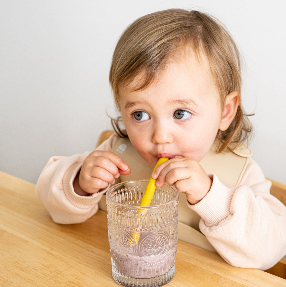 Baby drinking smoothie with Zazi silicone straw