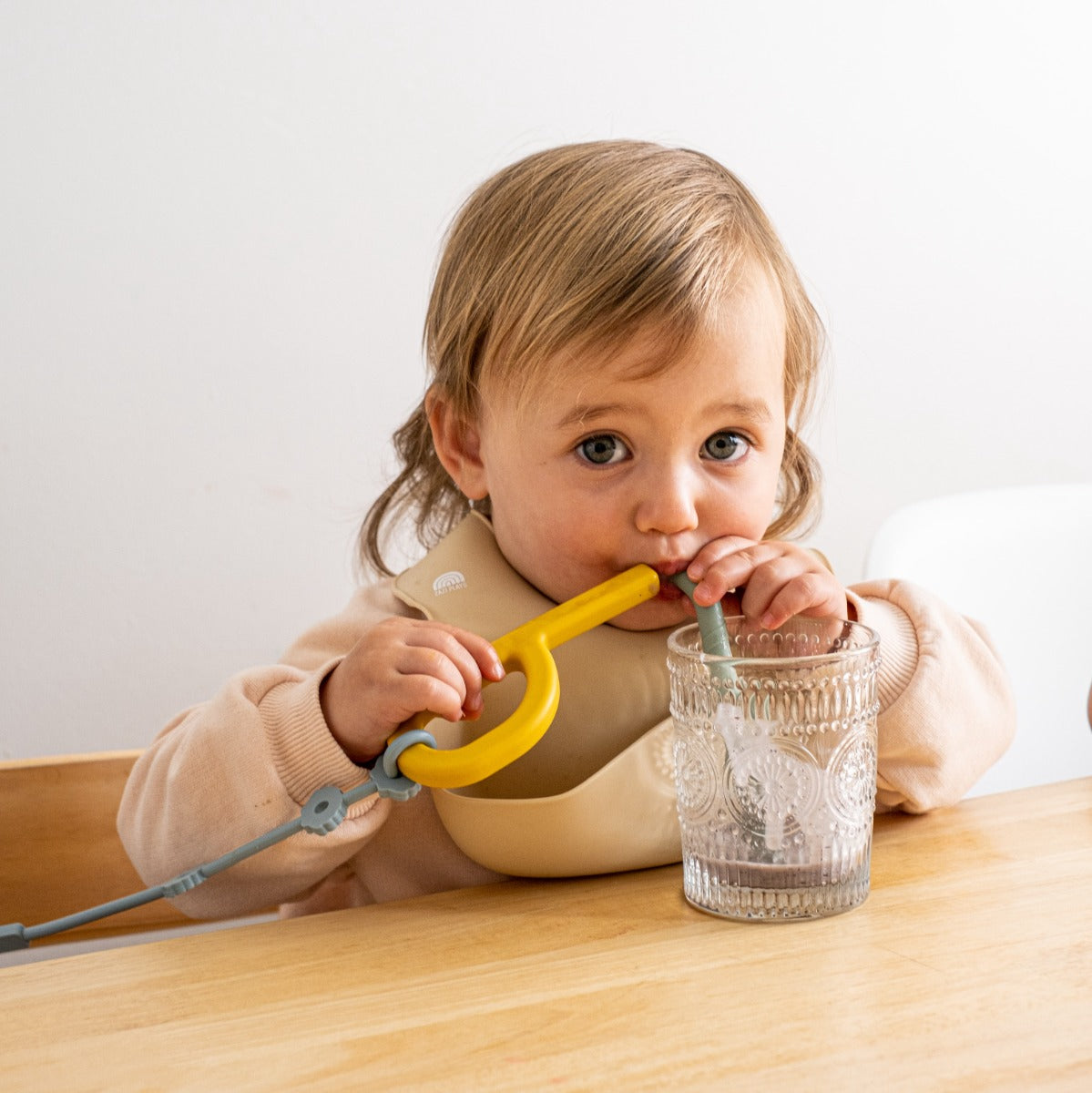 Baby drinking smoothie with Zazi silicone straw