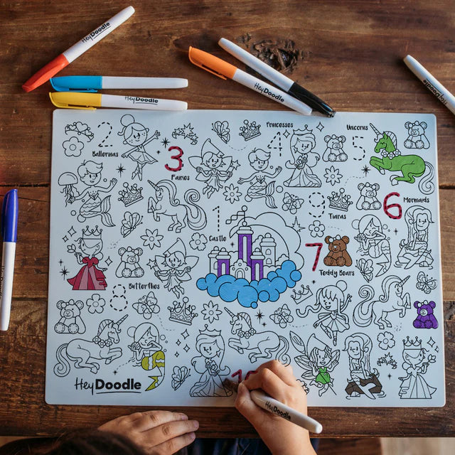 Girl colouting on Classic Sugar and Spice HeyDoodle silicone reusable colouring and doodle mat