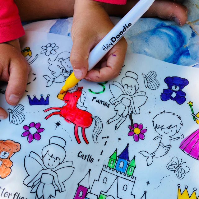 Gitl colouring on Classic Sugar and Spice HeyDoodle silicone reusable colouring and doodle mat