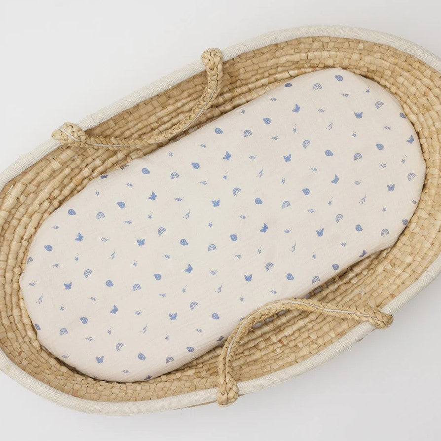Swaddle Enchanted Garden Over the Dandelion inside moses basket