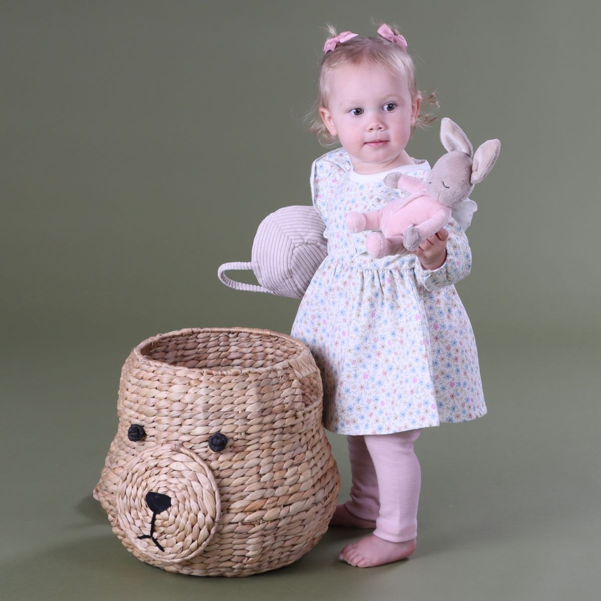 Baby girl playing with bunny wearing Cotton Fleece long sleeve Floral dress pairing it with merino leggings