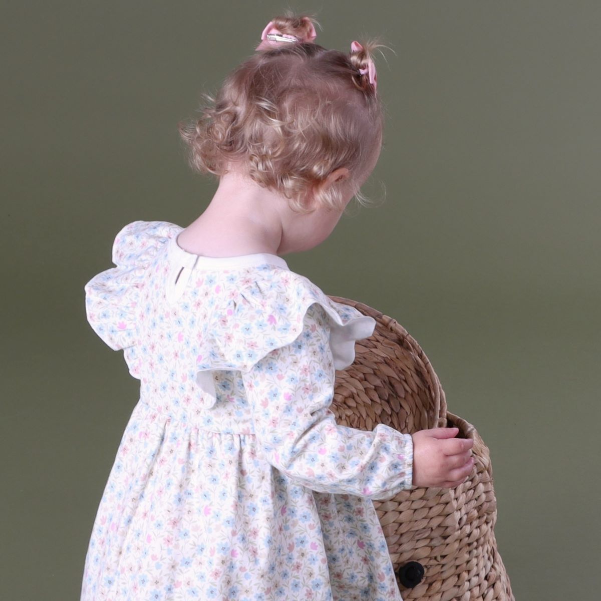 Baby girl playing with basket wearing Cotton Fleece long sleeve Floral dress 