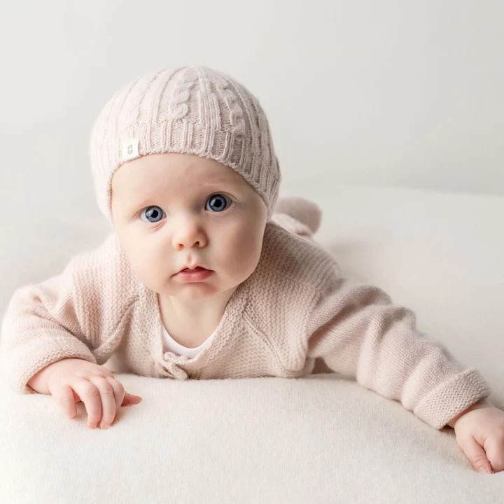 Benmore cable knit beanie in Blush Pink on baby