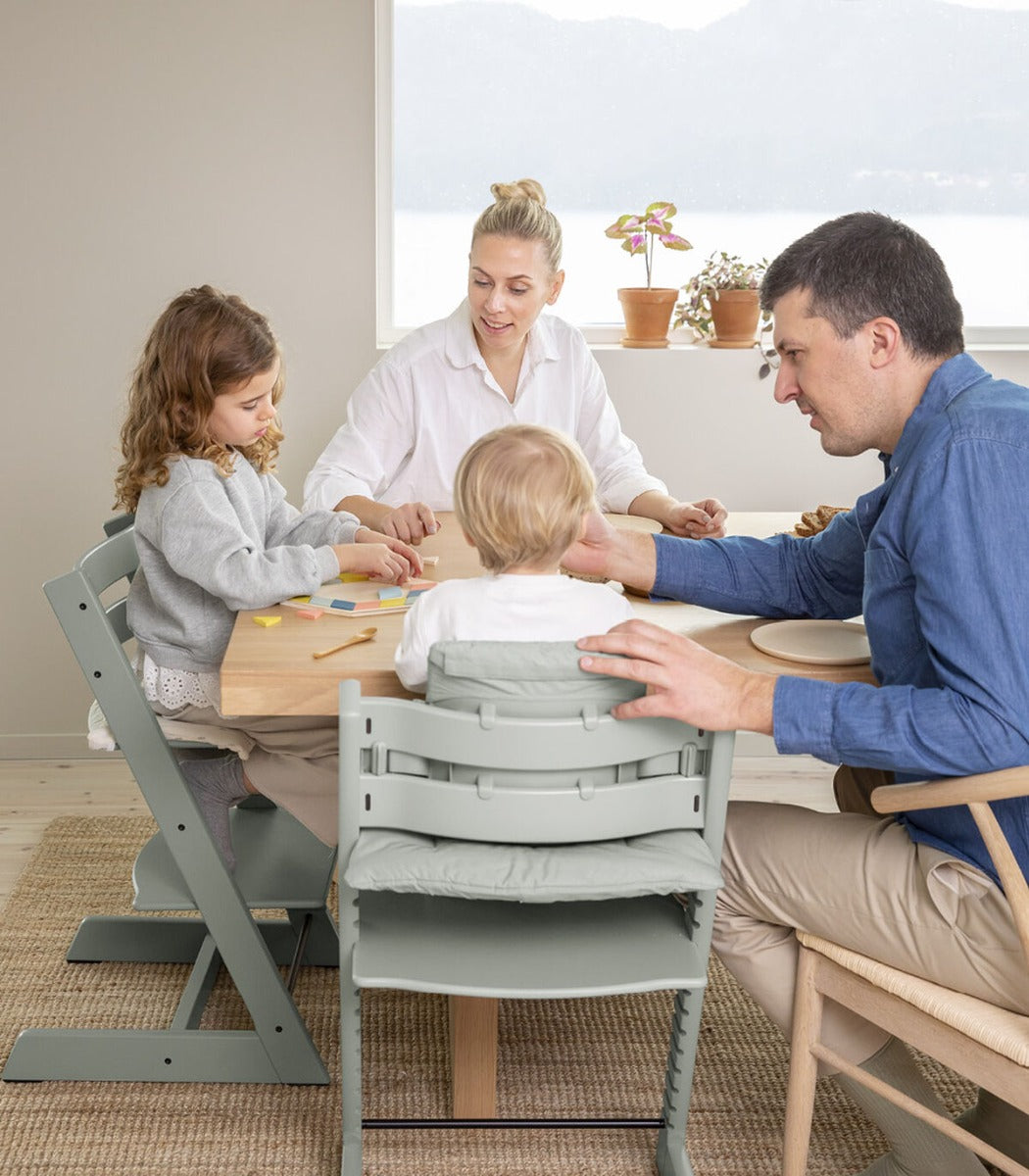 Stokke tripp trapp highchair in Glacier Green at the table with kids