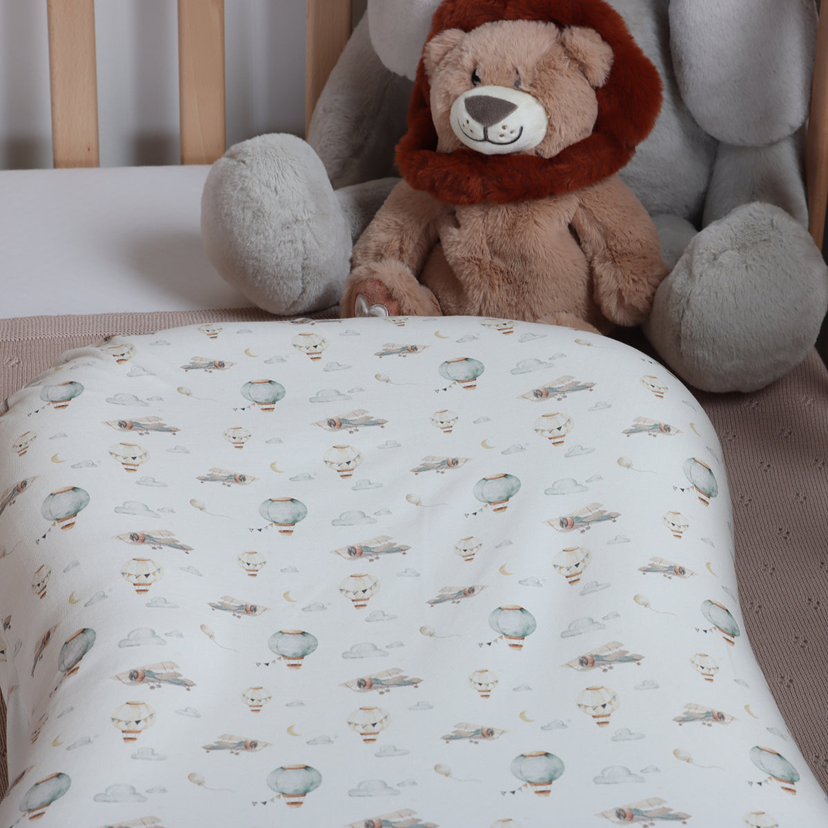 Cotton baby lounger cover on lounger in a cot