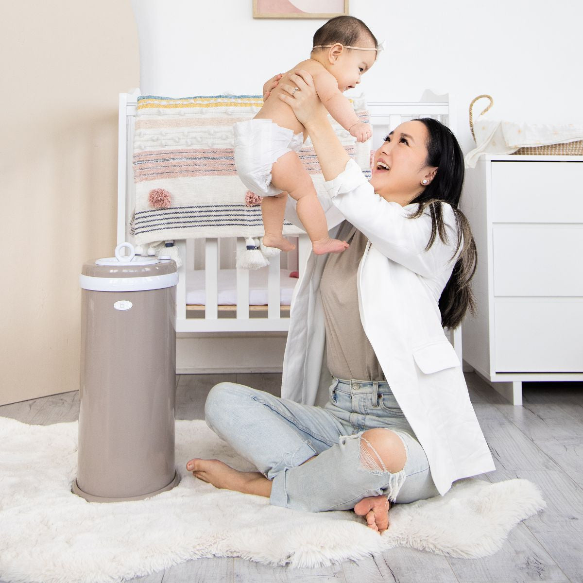 Ubbi Nappy Bin in Taupe in nursery