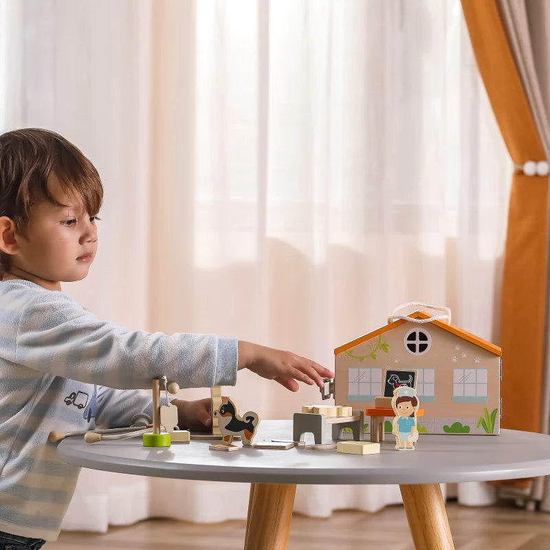 Boy playing with Viga Pet Hospital Set box as doctor and treating pet