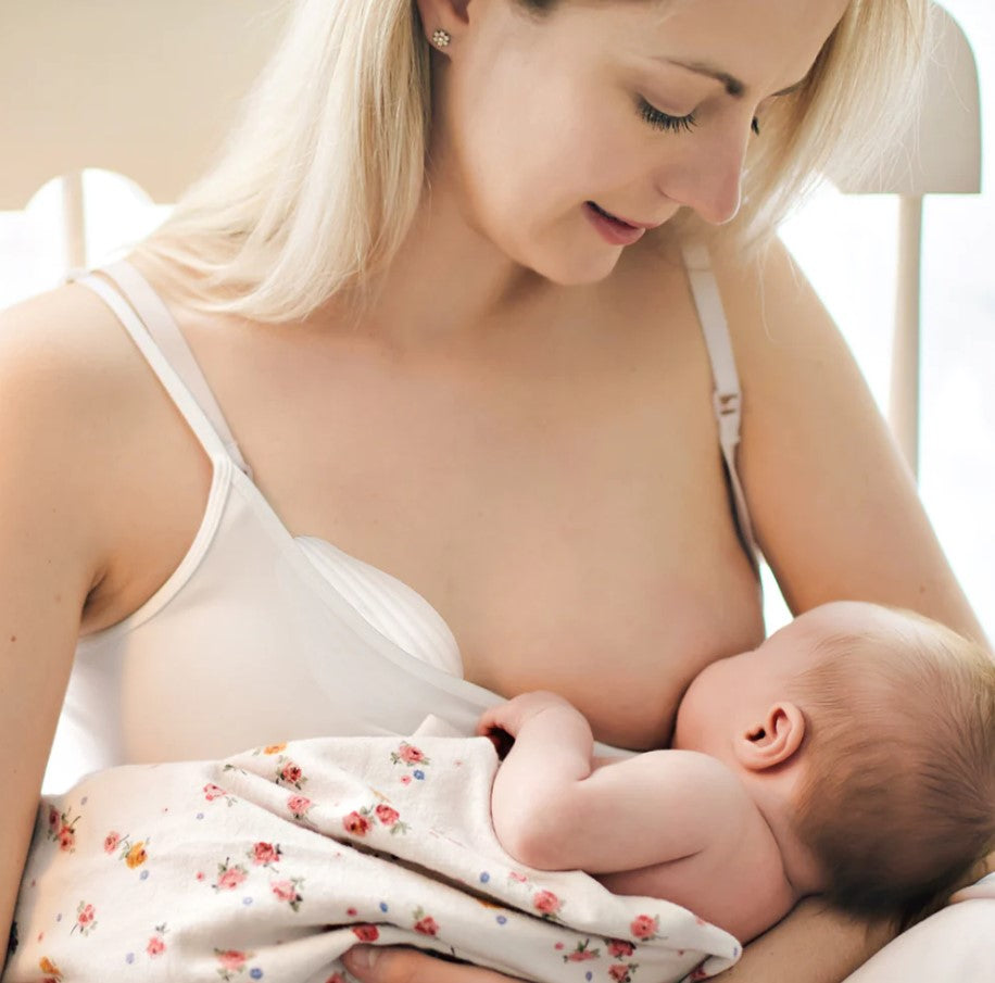 warming breast massager by haakaa while breast feeding