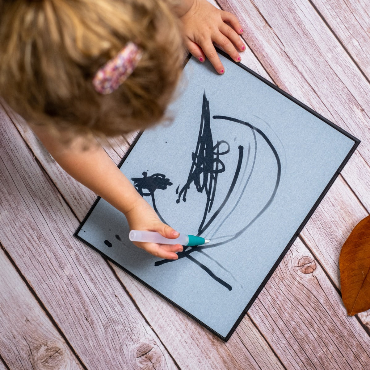 Baby playing with Magic Water - painting Board + 2 pens