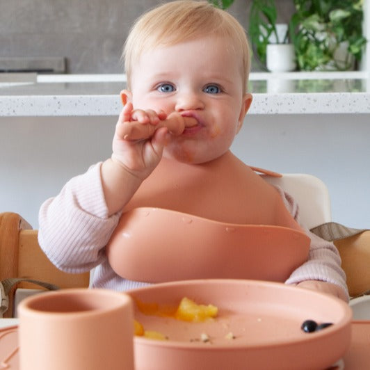Baby eating with Zazi fork, spoon and knife set