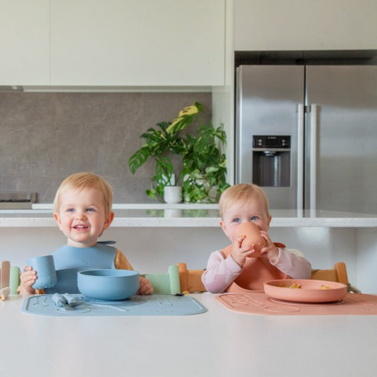 Baby eating in Zazi silicone plat with cutlery set and mat